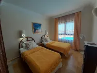 Tranquil setting, sea view, heated pool & Hot Tub, sub-tropical garden. - Ocean View