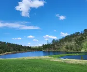 A beautiful mountain lake setting located in the 'Heart of the Black Hills'