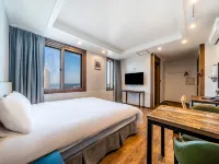 Check Inn Hotel Jeju Hôtels à proximité de : Place Tapdong