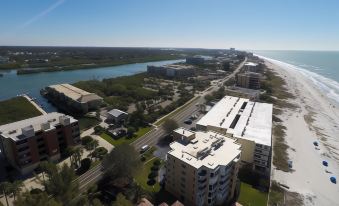 aerial view of a city near a beach , with buildings and roads visible in the distance at Legacy Vacation Resorts-Indian Shores