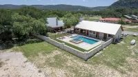 Ringers Lodge   Spacious 6-bedroom house on the River in charming Concan - Pools