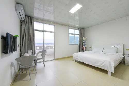 Beiqi Tantu Seaside Hostel - 2 ดาว