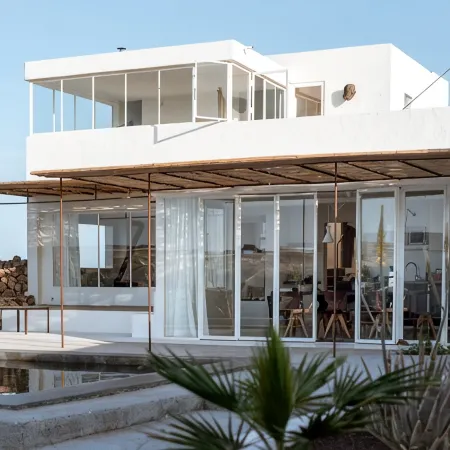An architectural oasis with large swimming pool, along a breath-taking scenery.