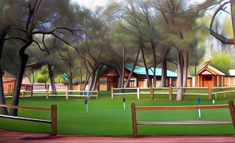 a painting of a golf course with benches , trees , and a building in the background at Kohl's Ranch Lodge