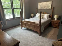 BEAUTIFUL lake front home with a private beach, dock and large yard