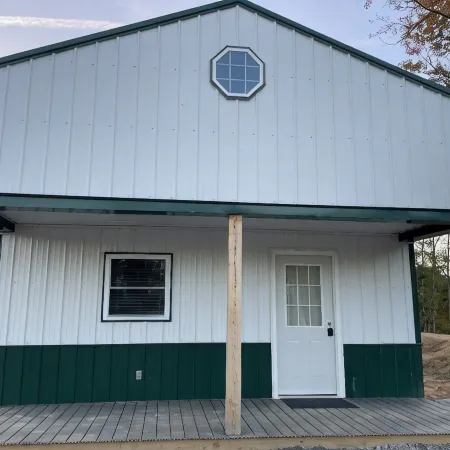 White cabin in the woods close to Univ. of Central Missouri and Whiteman AF Base
