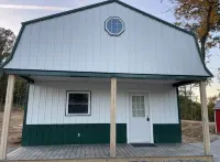 White cabin in the woods close to Univ. of Central Missouri and Whiteman AF Base
