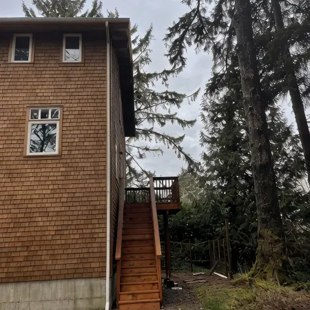 private hot tub, fun game room, cozy beach house