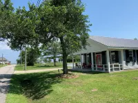 Ground level home steps from the beach in Waveland - 4-Star