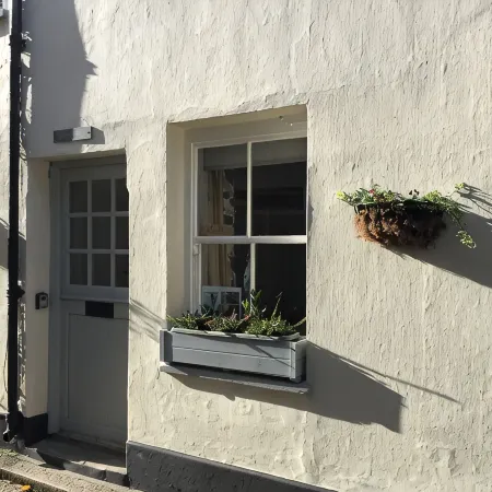 HOWTON COTTAGE - village cottage on coast path next to beaches