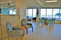 Dolphin Beach condo with indoor pool, ocean views, steps to the beach