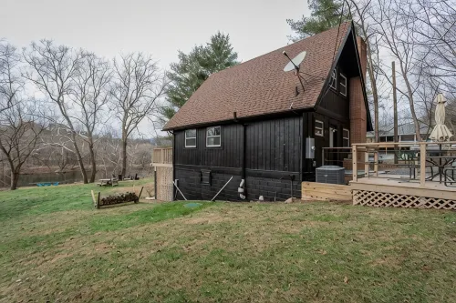 Modern Riverfront A-Frame Cabin w/ Hot Tub, Fire Pit, Kayaks, Canoe, & Arcade