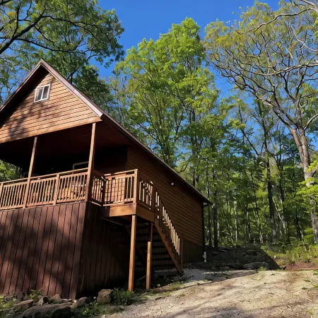 Cowboy Cabin is Nestled in a Little Woodland Village – Playground, Pond and More