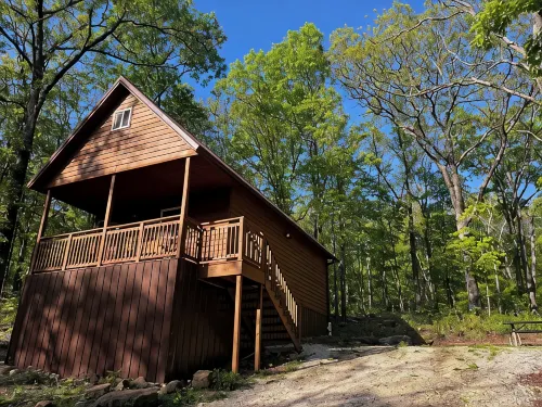 Cowboy Cabin is a quiet place to camp in the woods with the amenities of home.