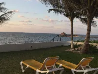 Quiet and serene ocean front 2-bedroom 2-bathroom condo, steps from the sand!