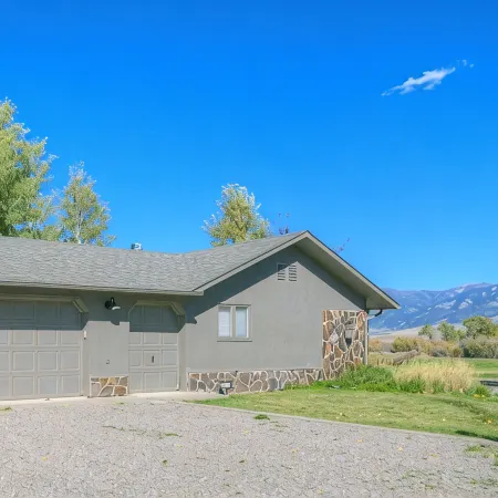 Luxury Home on Blue Ribbon Madison River and steps away from downtown Ennis, MT.