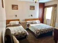 Atlantic Guest House Hotels near St Pius X Church