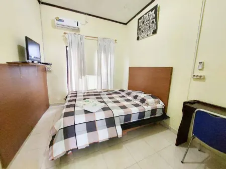 Quattrick Dee Homestay Mitra RedDoorz Отели в г. Маноквари