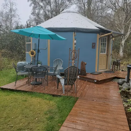 Fanciful mountainside yurt with private bathhouse