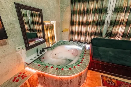 Tafana Cave & Stone Lodge Отели в г. Ургуп