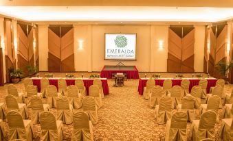 a conference room with chairs arranged in rows and a large screen on the wall at Emeralda Resort Ninh Binh
