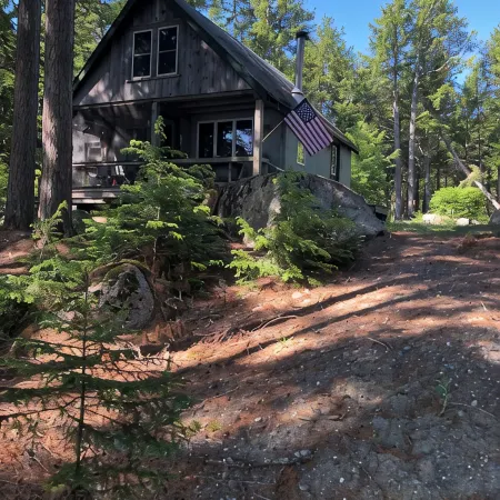 Cozy, Off-Grid Camp on Spectacle Pond w/ private water frontage!