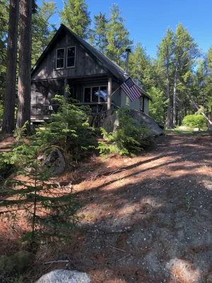 Cozy, Off-Grid Camp on Spectacle Pond w/ private water frontage!