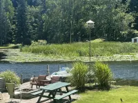 Cottage 1 is a charming 2 bedroom only 25’ from its boat dock & Hamlin lake. Hotel a Hamlin Township