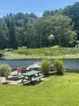 Cottage 1 is a charming 2 bedroom only 25’ from its boat dock & Hamlin lake. - 2-Star