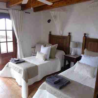Volcanic lava stone house short walk to the beach, sea and mountain views Rooms