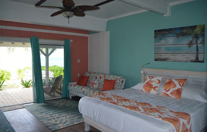Beachfront one bedroom studio with full kitchen, covered porch and open deck.