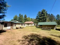 Waterfront Cabin w/ Private Dock & Outdoor Bar near Munising/Manistique - 2-Star