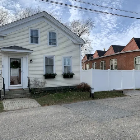 Exceptional location footsteps to beautiful downtown Mystic w/private driveway