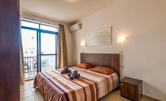 Seashells Apartments with Terrace, Just Off the Seafront in Bugibba - by Getawaysmalta