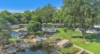 This house is located on North Webster Lake and features a hot tub. - Gym
