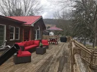 Spectacular Catskill Mountain River Front Custom Log Home
