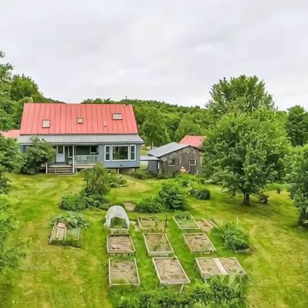 Hill top home located on 30 acres with privacy and surrounding natural beauty.