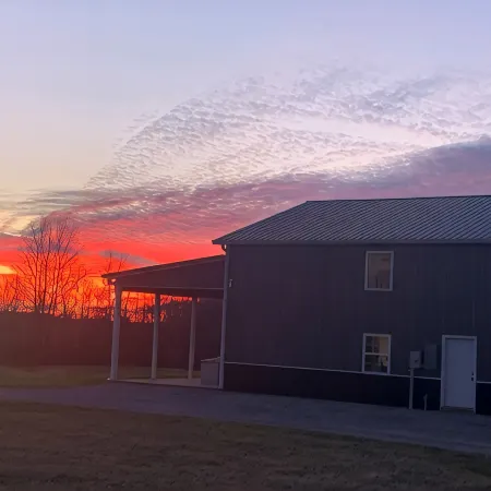 Barndominium in the country. Two acre fishing lake, large porch and Pickleball.