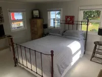 Cozy Cabin with 165 Ft Beach and Wood-Fired Hot Tub! Center of Flx Wine Country!