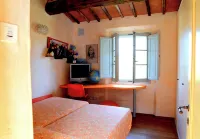 Tuscan village in SIena. farmhouse surrounded by garden,pool and panoramic view
