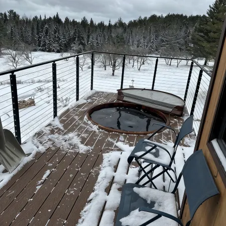 Enjoy whatever winter throws at you while you relax in the hot tub with a view!