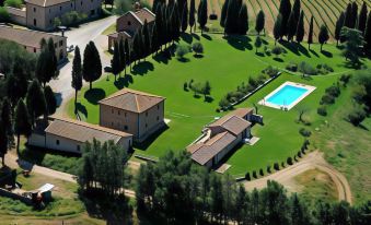 aerial view of a large property with a swimming pool surrounded by grass , trees , and buildings at Rookery Hall Hotel & Spa