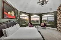 Castle on a hill, breathtaking views, surrounded with pools, trees, and lawn