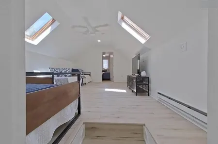 2-bedroom house on Strawberry Lake in Pinckney, MI with hot tub, WiFi.