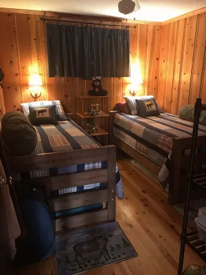 Quaint two bedroom cabin just a few steps away from and on Mountain Rest Lake.