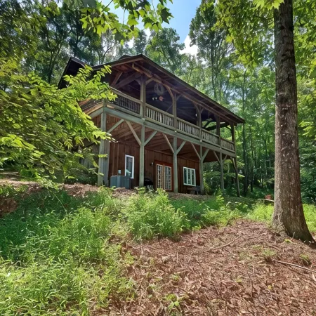 A Laurel Haven, with big porches and a log cabin feel. Fireplace.