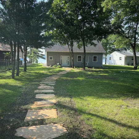 Big Pine Lakefront Retreat with Private Beach, Dock, Fire Pit & Sunset Views