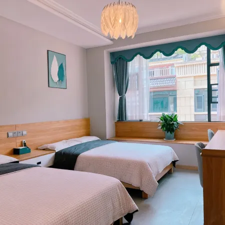 Yuan·Orange Xi Homestay Отели в г. Цигуй