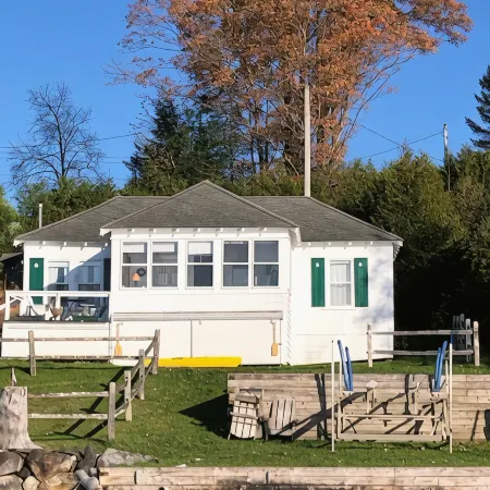 Charming cottage on Lake Willoughby w/ sun porch, private deck and dock.