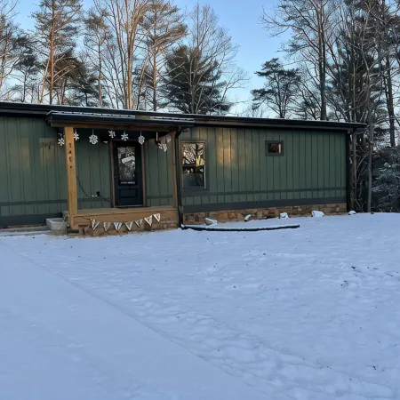 Luxury cabin in county but not far from downtown. Hot tub on back porch.